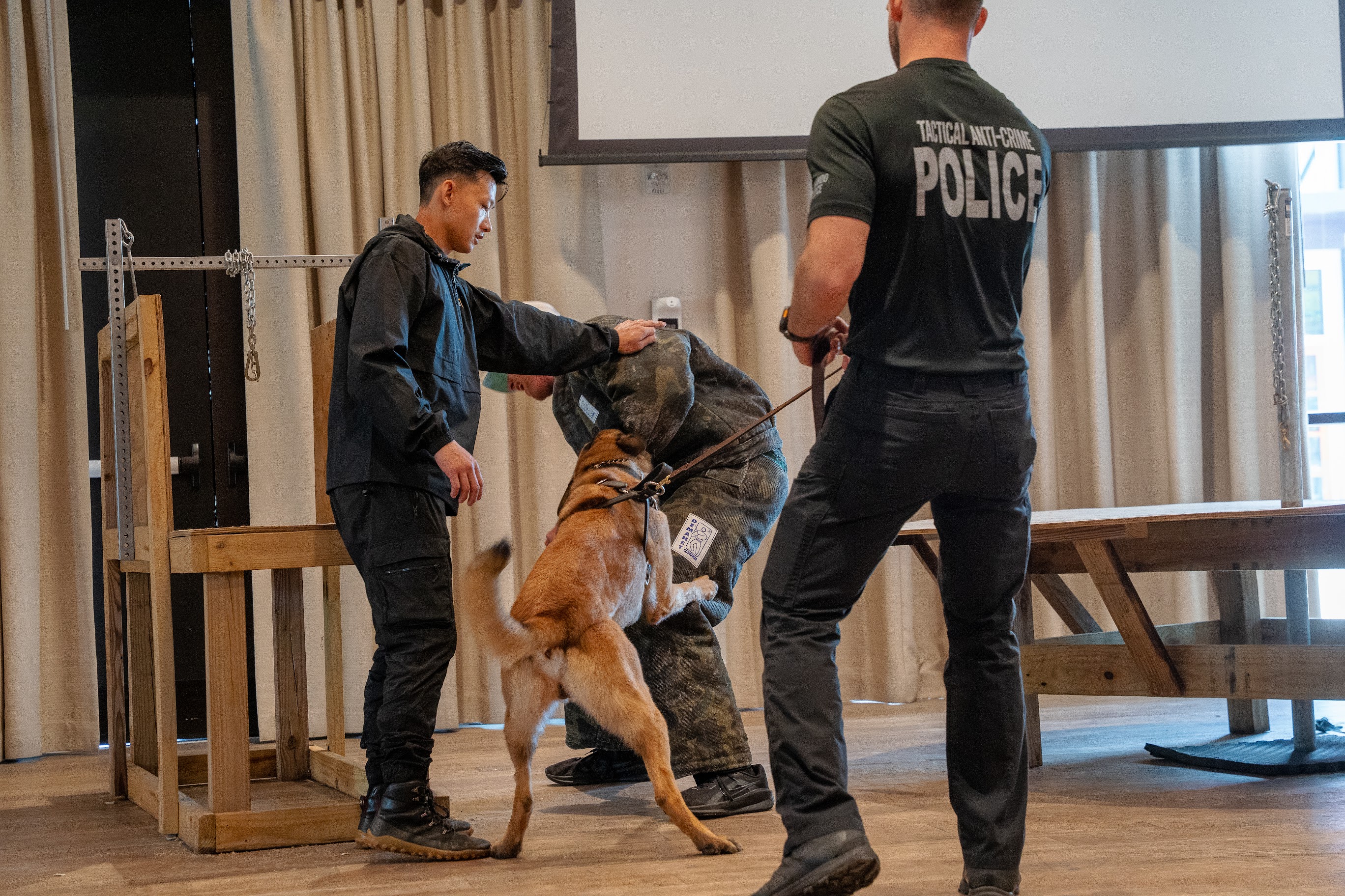 Police K9 performing controlled bitework with a decoy during a law enforcement K9 training seminar.